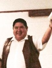 Rev. Patrick Stands Over Bull,